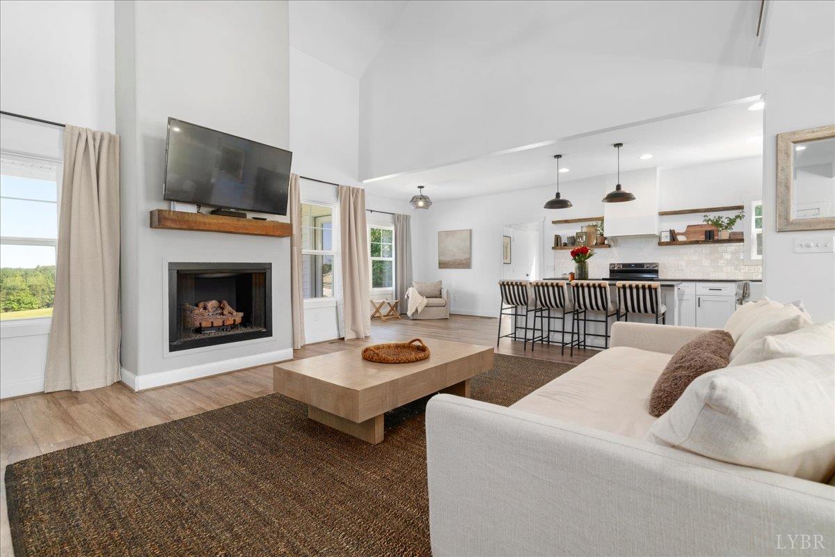 1393 Stonewall Road Concord, VA 24538 - Photo 12 of 85 a living room with furniture and a fireplace