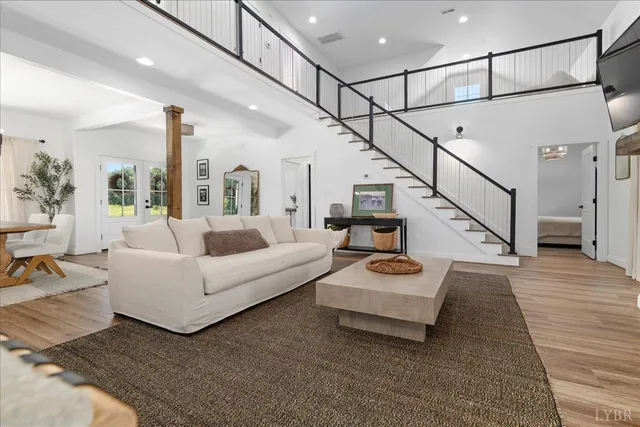 a living room with a couch and a window