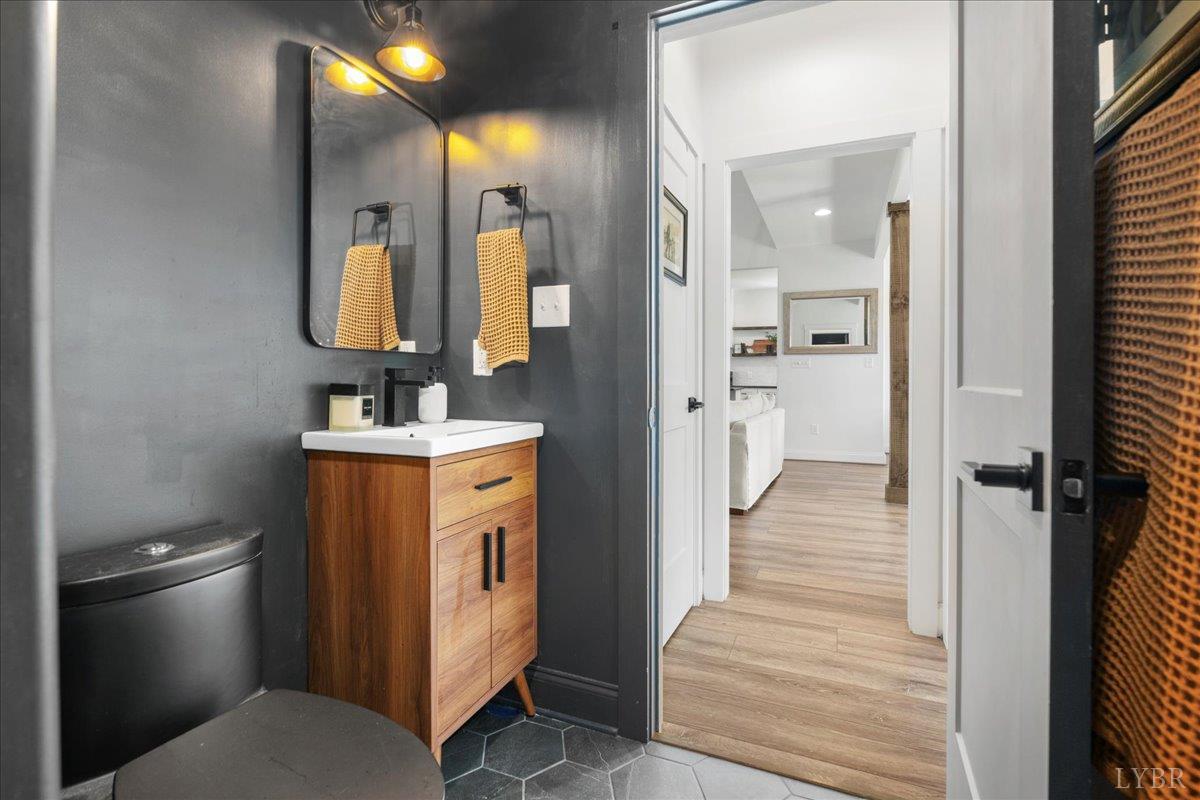 1393 Stonewall Road Concord, VA 24538 - Photo 30 of 85 a en suite bathroom with a sink and a mirror