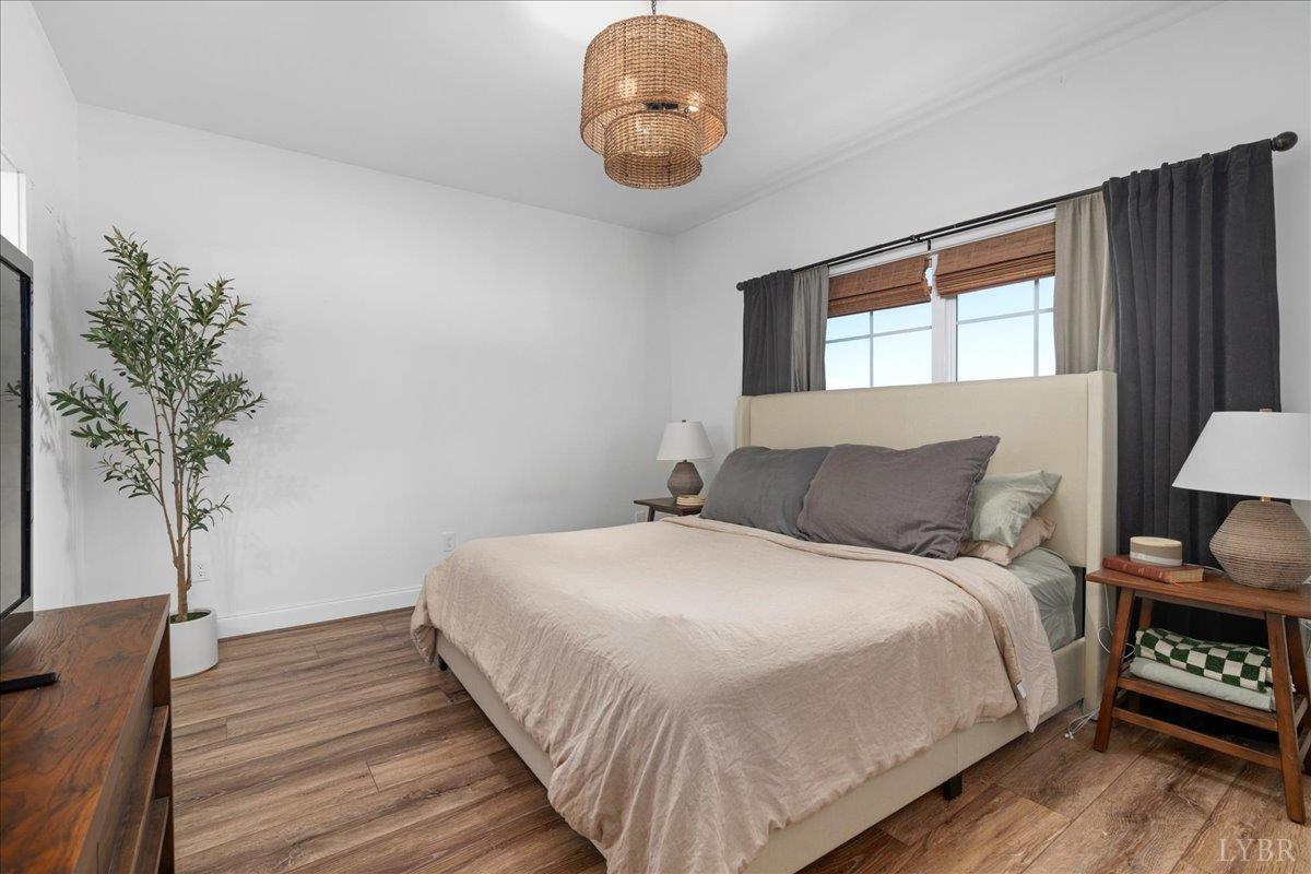 1393 Stonewall Road Concord, VA 24538 - Photo 33 of 85 a bedroom with bed and a potted plant