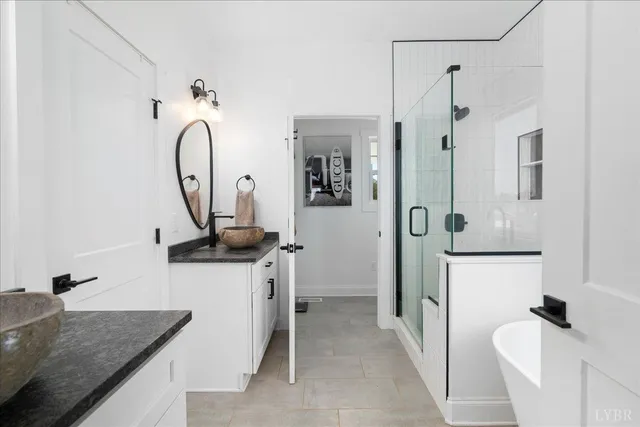 a view of a house with a yard patio and fire pit