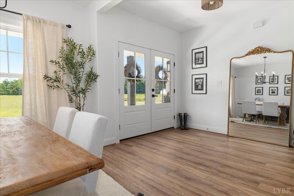 1393 Stonewall Road Concord, VA 24538 - Photo 4 of 85 a view of an empty room with wooden floor and a window