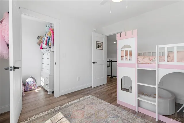 a view of swimming pool with a yard and large tree