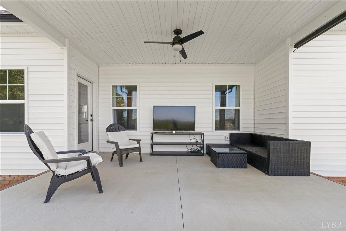 1393 Stonewall Road Concord, VA 24538 - Photo 49 of 85 a living room with furniture and a flat screen tv