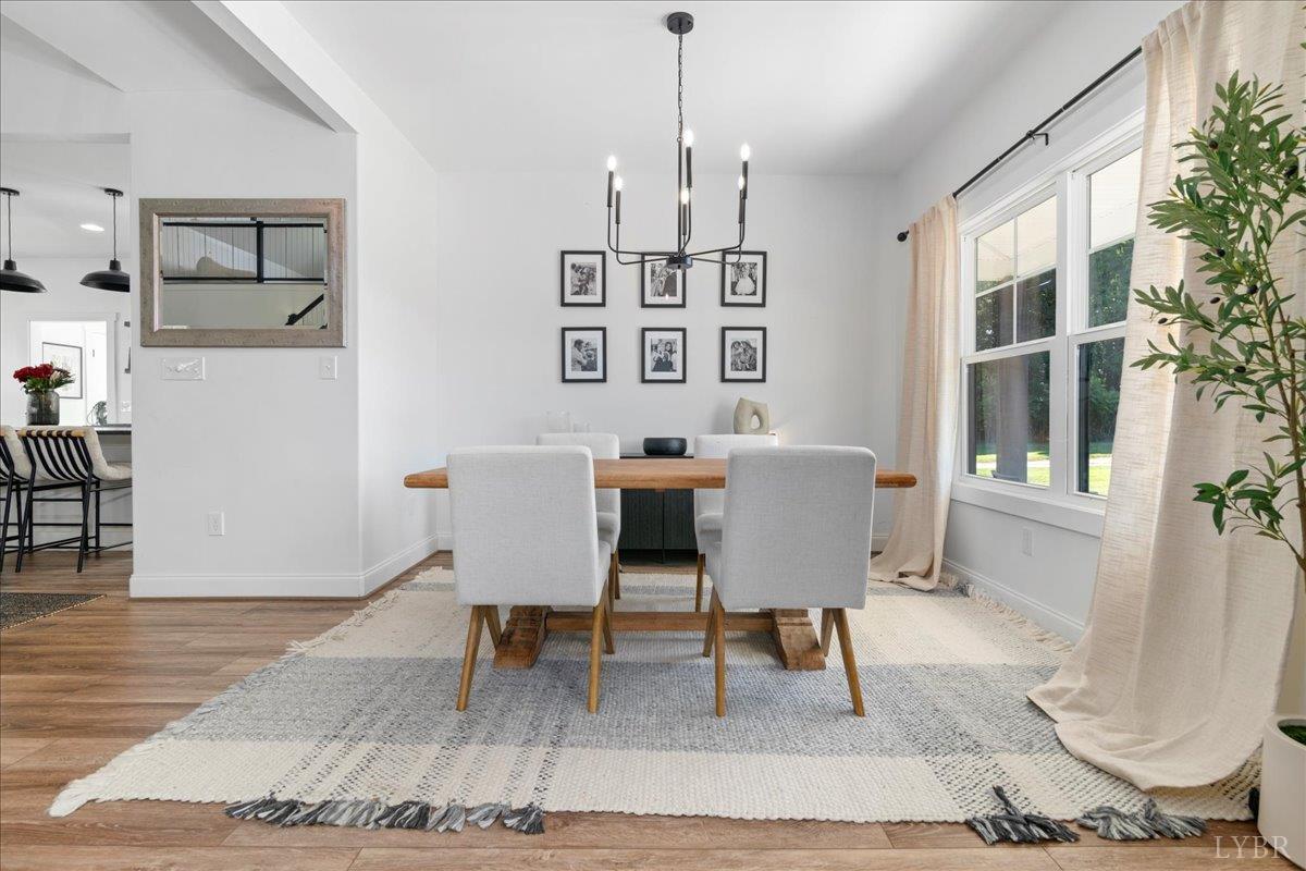 1393 Stonewall Road Concord, VA 24538 - Photo 5 of 85 a view of a dining room with furniture and wooden floor