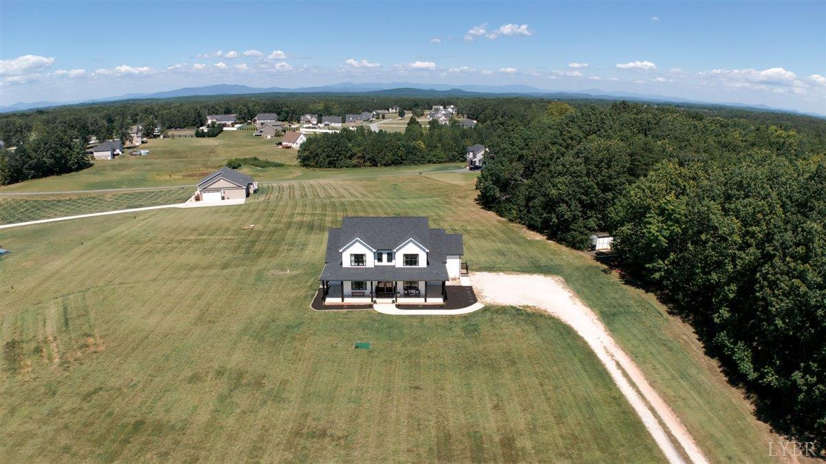 1393 Stonewall Road Concord, VA 24538 - Photo 62 of 85 a view of a swimming pool with an outdoor space and seating area