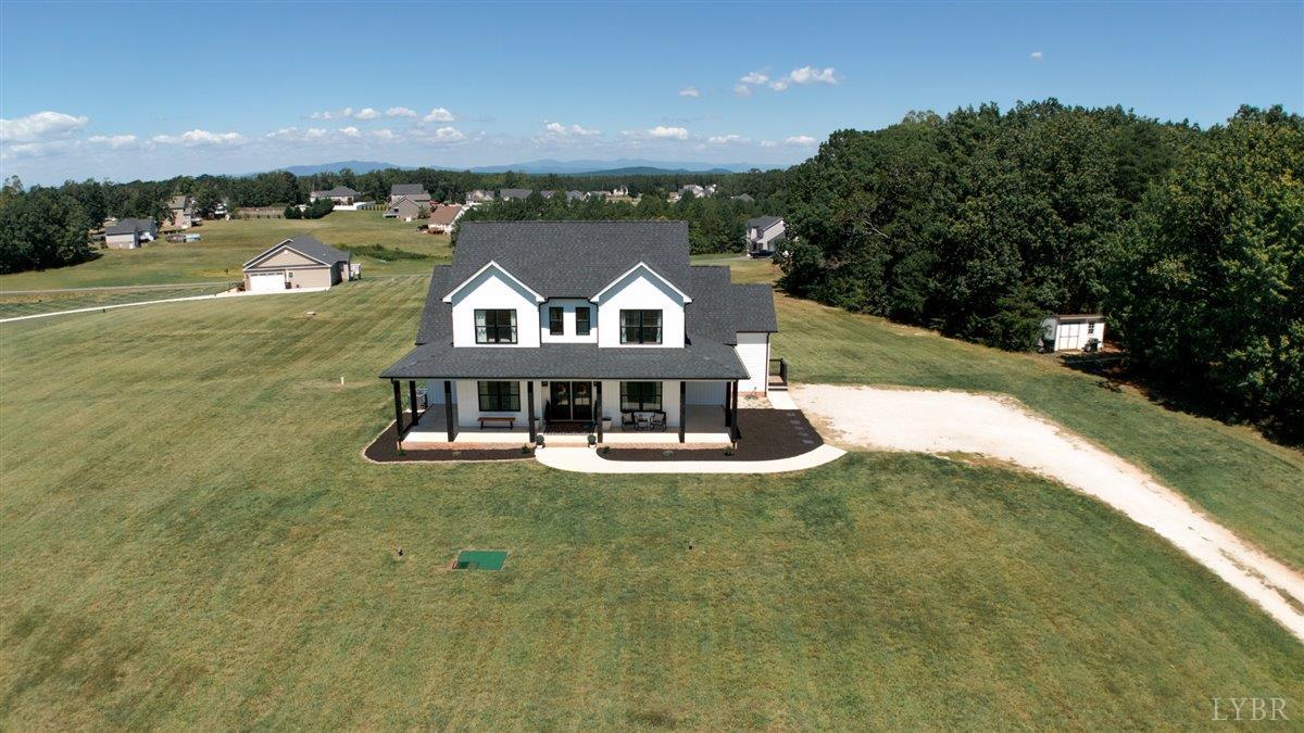 1393 Stonewall Road Concord, VA 24538 - Photo 63 of 85 a view of a large body of water with a building in the background