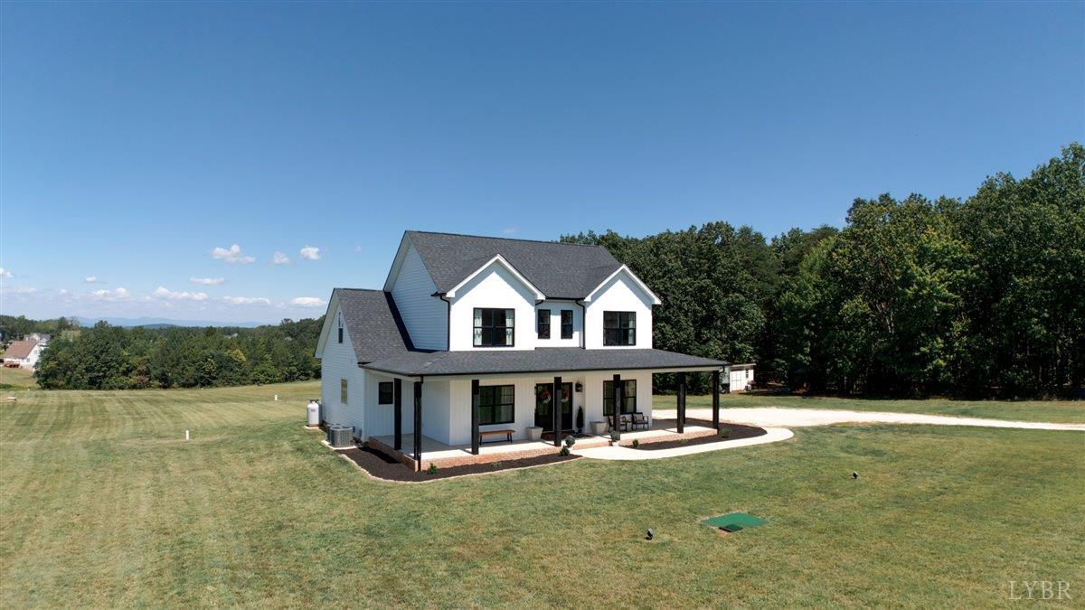 1393 Stonewall Road Concord, VA 24538 - Photo 66 of 85 a view of a house with pool and a yard