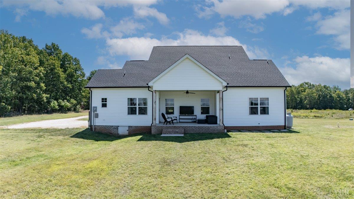 1393 Stonewall Road Concord, VA 24538 - Photo 72 of 85 a front view of a house with a garden and yard
