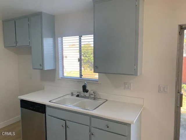 a kitchen with a sink and cabinets