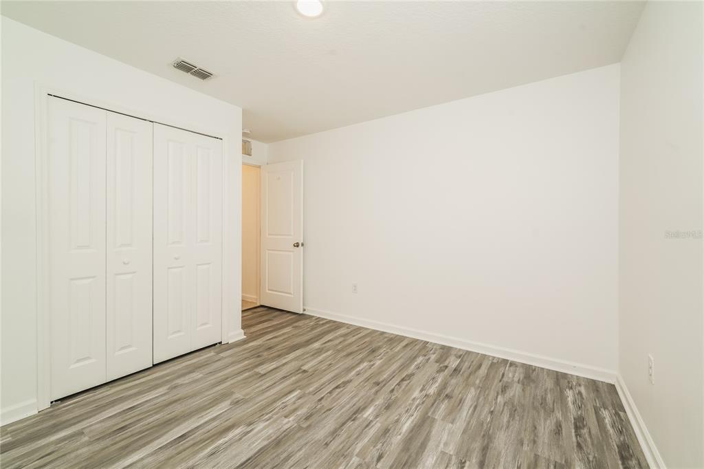 1473 Lucerne Loop Road Northeast Winter Haven, FL 33881 - Photo 18 of 25 a view of an empty room
