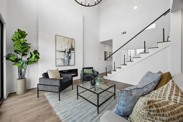 a living room with furniture and a potted plant
