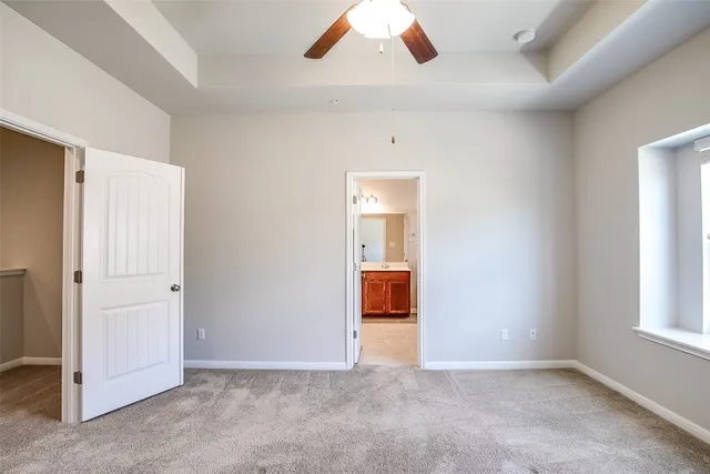 a spacious bathroom with a double vanity sink mirror and shower