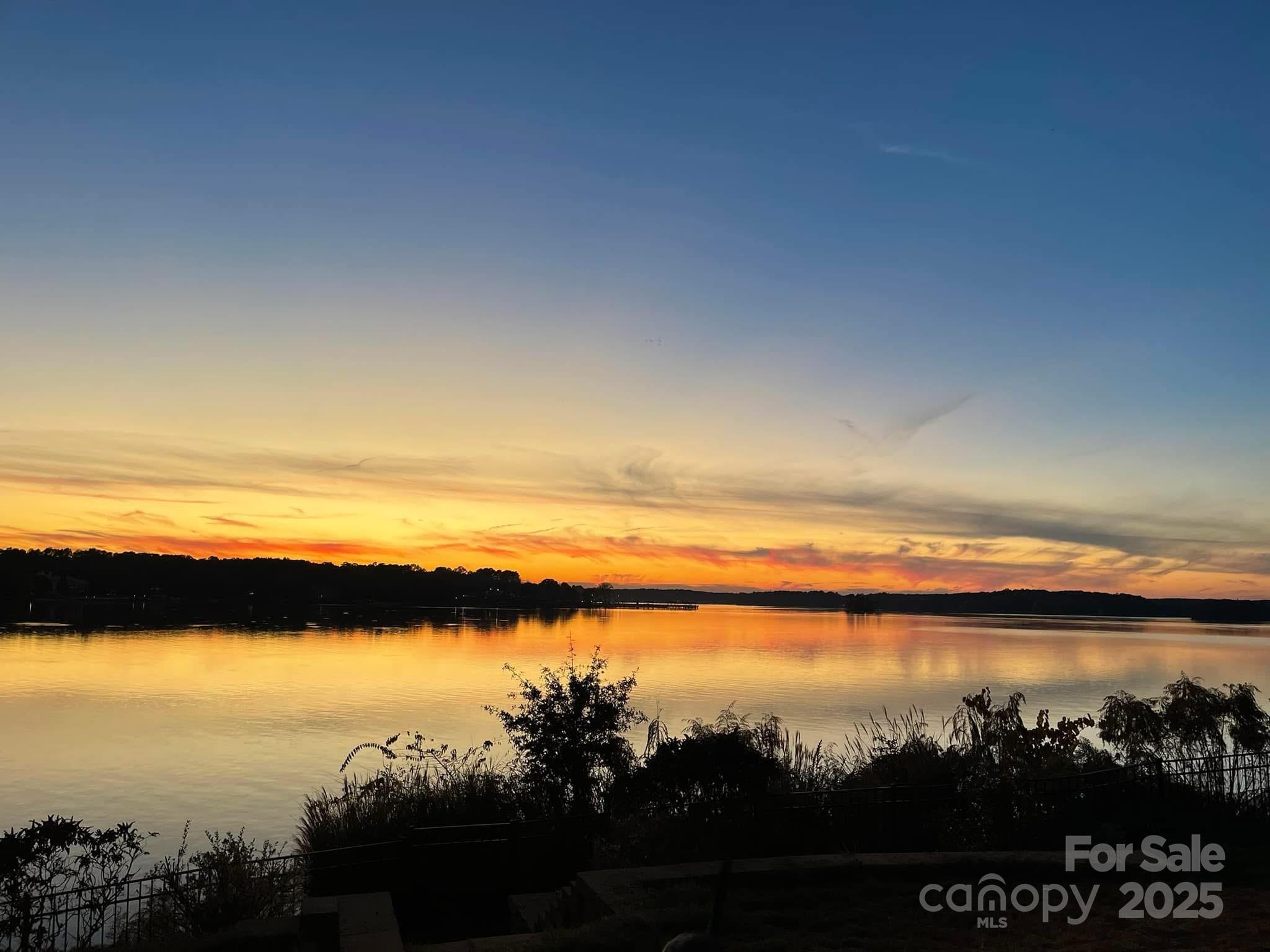 31009 Executive Point Tega Cay, SC 29708 - Photo 1 of 2 a view of lake with sunset