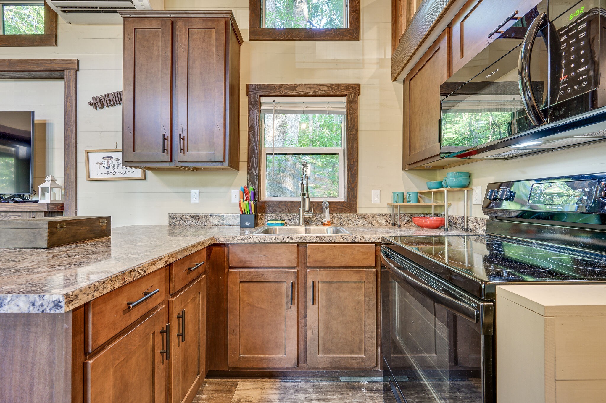 30 Oakleaf Trail Tracy City, TN 37387 - Photo 18 of 50 a kitchen with stainless steel appliances granite countertop a sink stove and cabinets