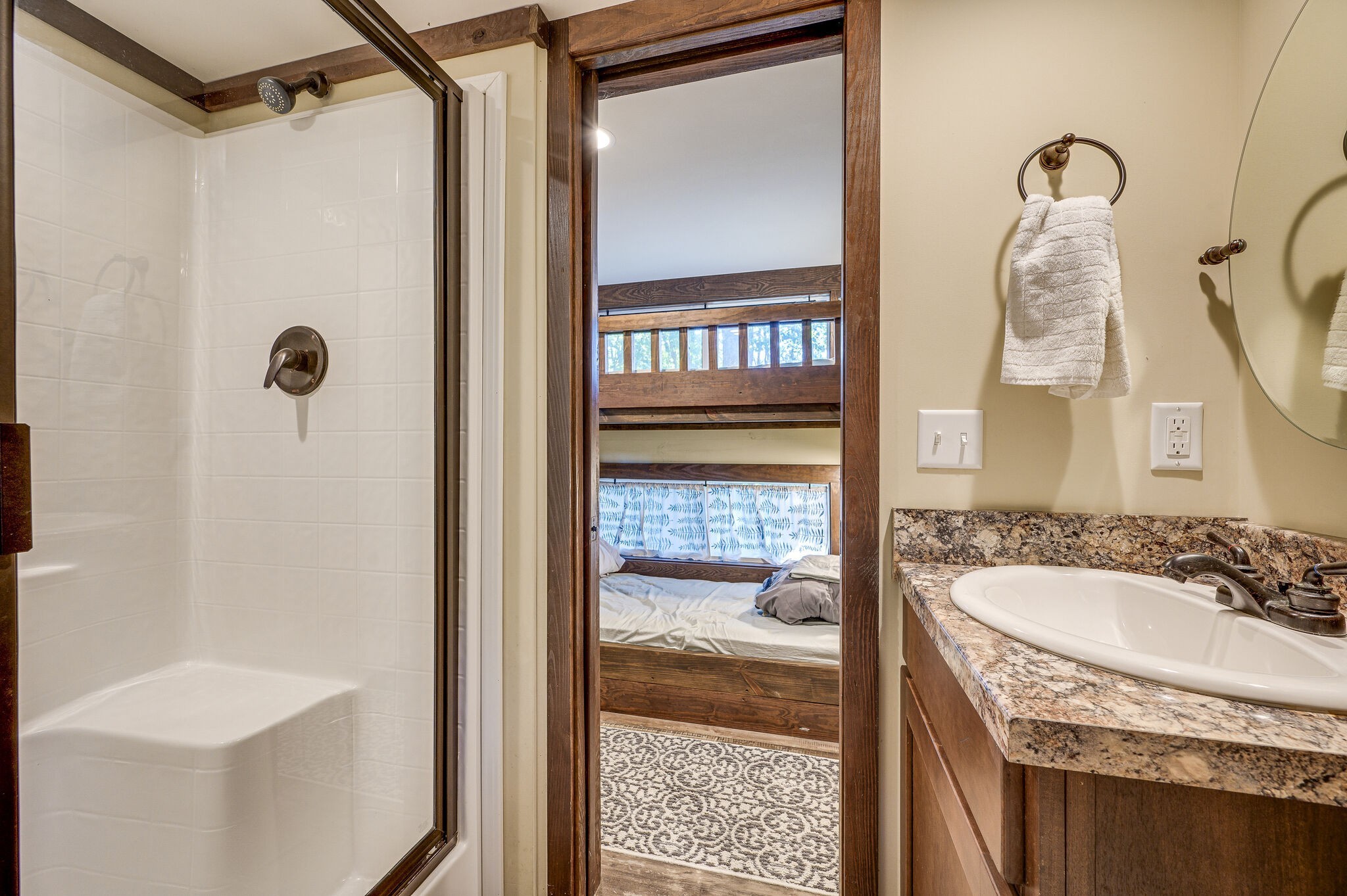 30 Oakleaf Trail Tracy City, TN 37387 - Photo 22 of 50 a bathroom with a granite countertop sink a mirror and shower