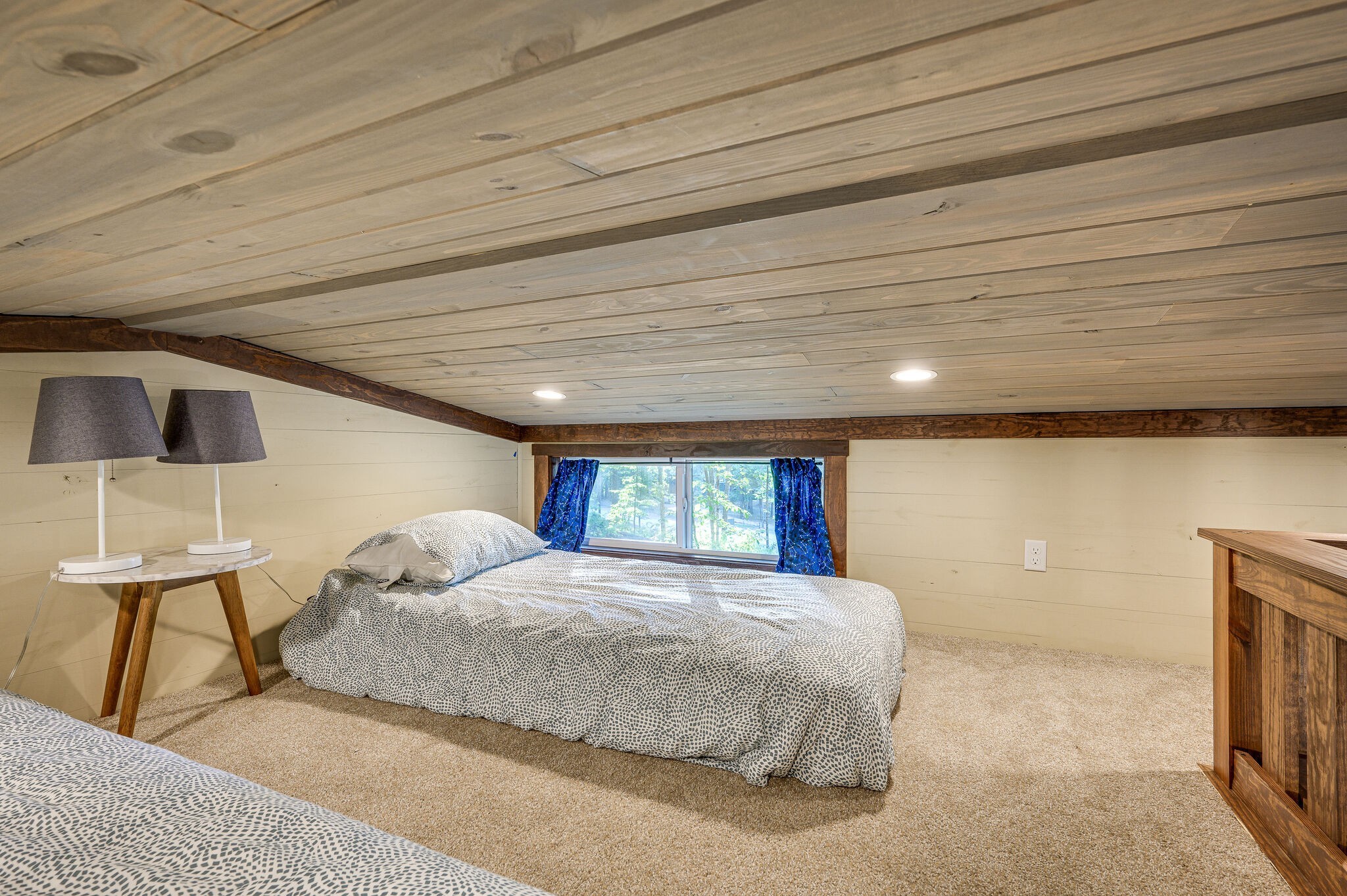 30 Oakleaf Trail Tracy City, TN 37387 - Photo 26 of 50 a bedroom with a large bed and a flat tv screen on dresser
