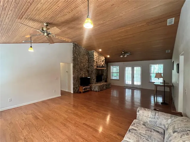 a view of a livingroom with furniture and furniture