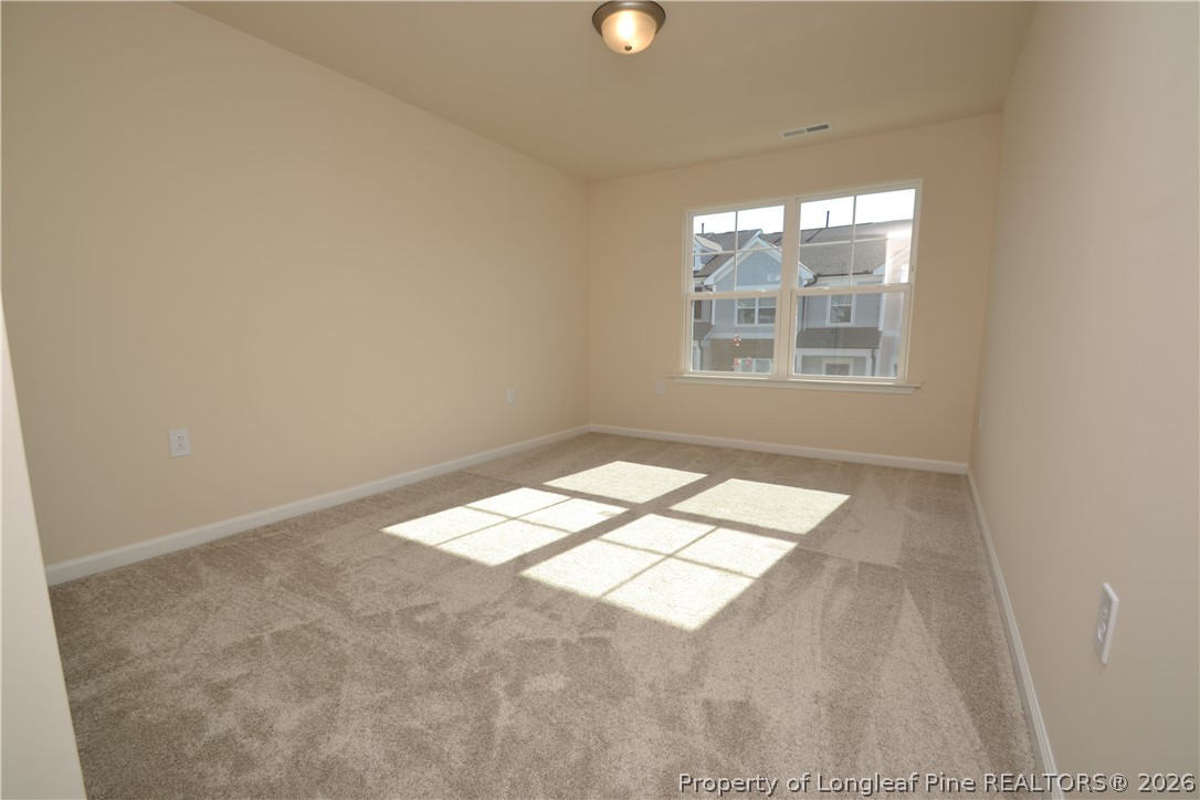 5703 Preveza Place Raleigh, NC 27603 - Photo 18 of 33 an empty room with a window