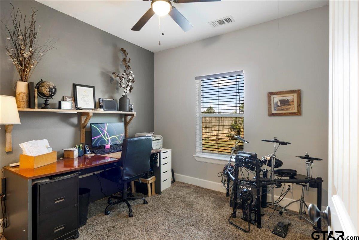 19577 Dove Ridge Lane Lindale, TX 75771 - Photo 19 of 42 a view of a workspace with furniture and a window
