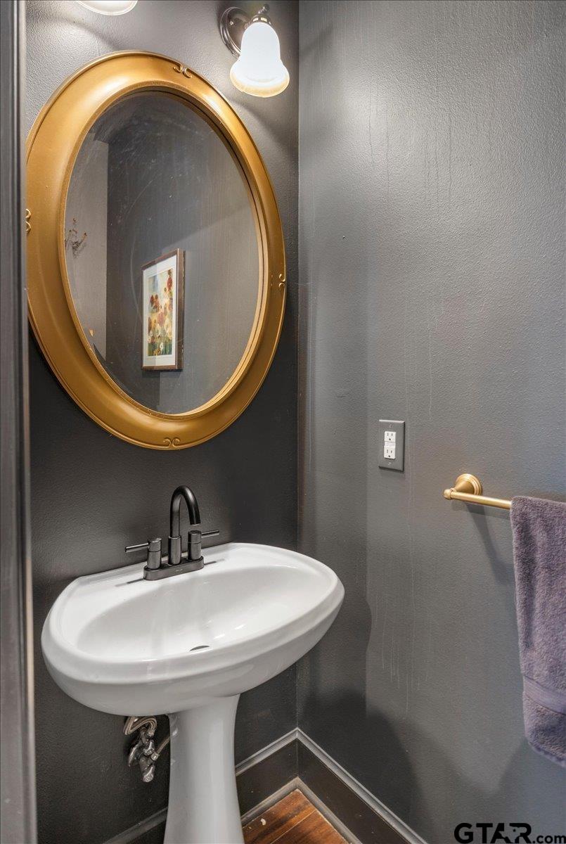 19577 Dove Ridge Lane Lindale, TX 75771 - Photo 30 of 42 a bathroom with a sink and mirror