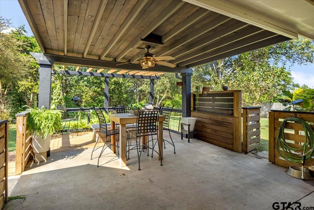 19577 Dove Ridge Lane Lindale, TX 75771 - Photo 32 of 42 a view of a patio with table and chairs and potted plants