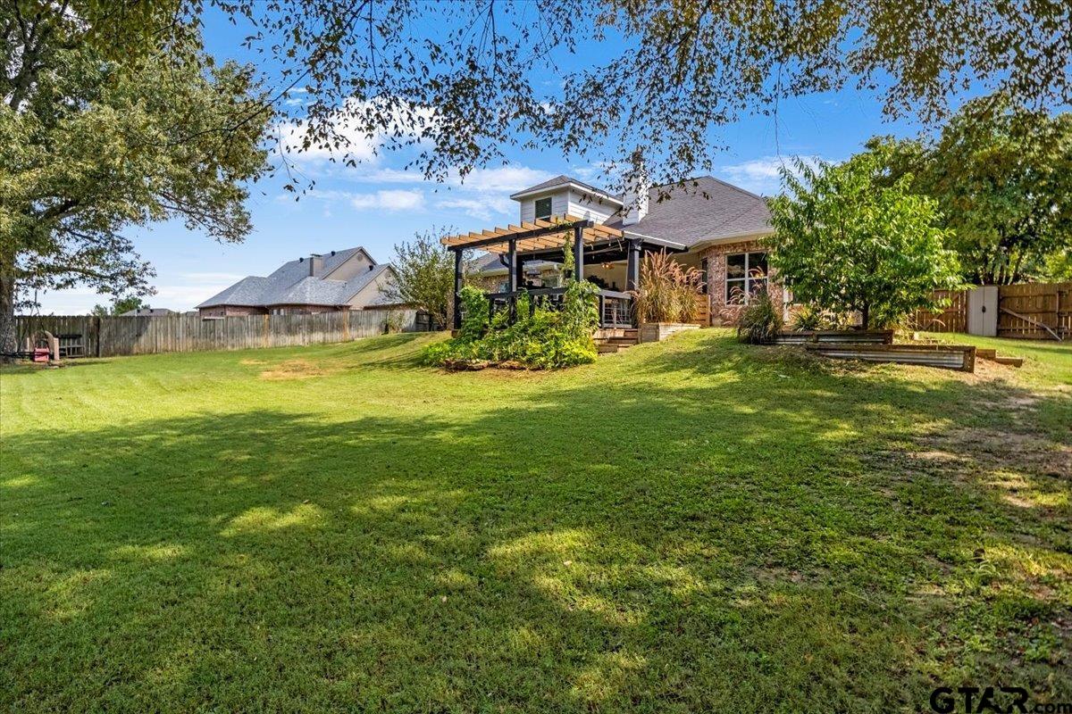 19577 Dove Ridge Lane Lindale, TX 75771 - Photo 37 of 42 a front view of a house with a yard table and chairs