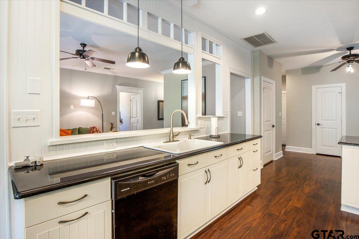 19577 Dove Ridge Lane Lindale, TX 75771 - Photo 10 of 42 a kitchen with granite countertop a sink and cabinets