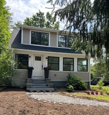 front view of a house with a yard