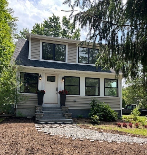 front view of a house with a yard