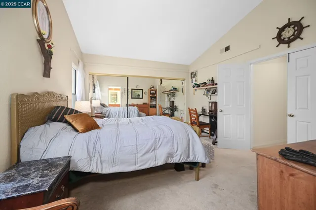 a bed room with a bed and a couch