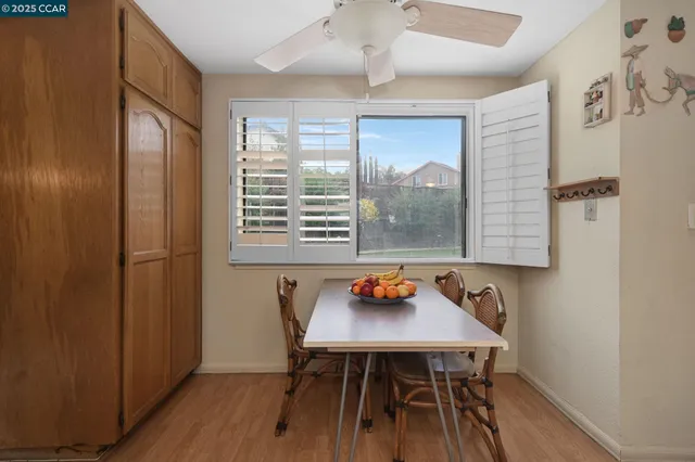 a view of a dining room with furniture and window