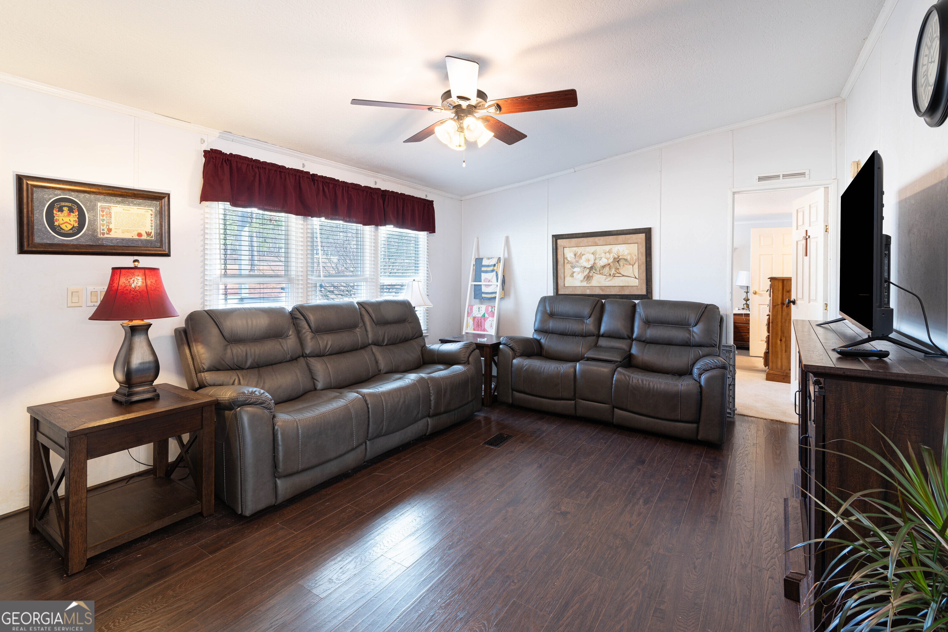 161 Cherokee Trail Forsyth, GA 31029 - Photo 24 of 39 a living room with furniture and a flat screen tv