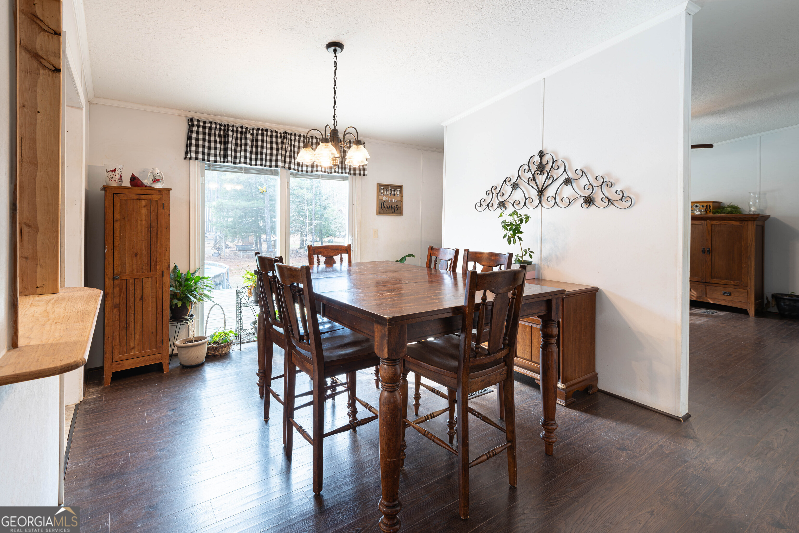 161 Cherokee Trail Forsyth, GA 31029 - Photo 26 of 39 a view of a dining room with furniture window and wooden floor