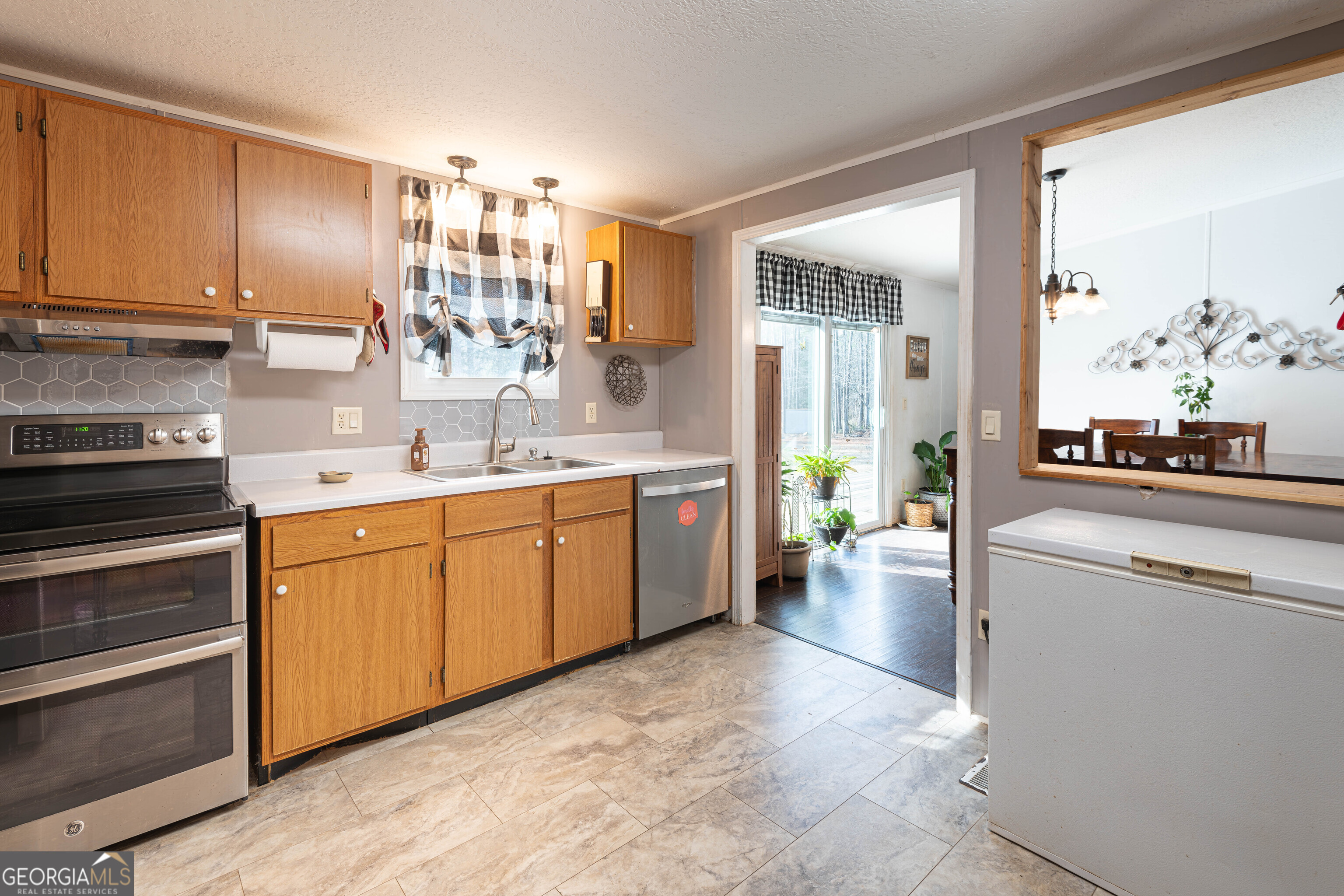 161 Cherokee Trail Forsyth, GA 31029 - Photo 30 of 39 a kitchen with a sink stove and cabinets