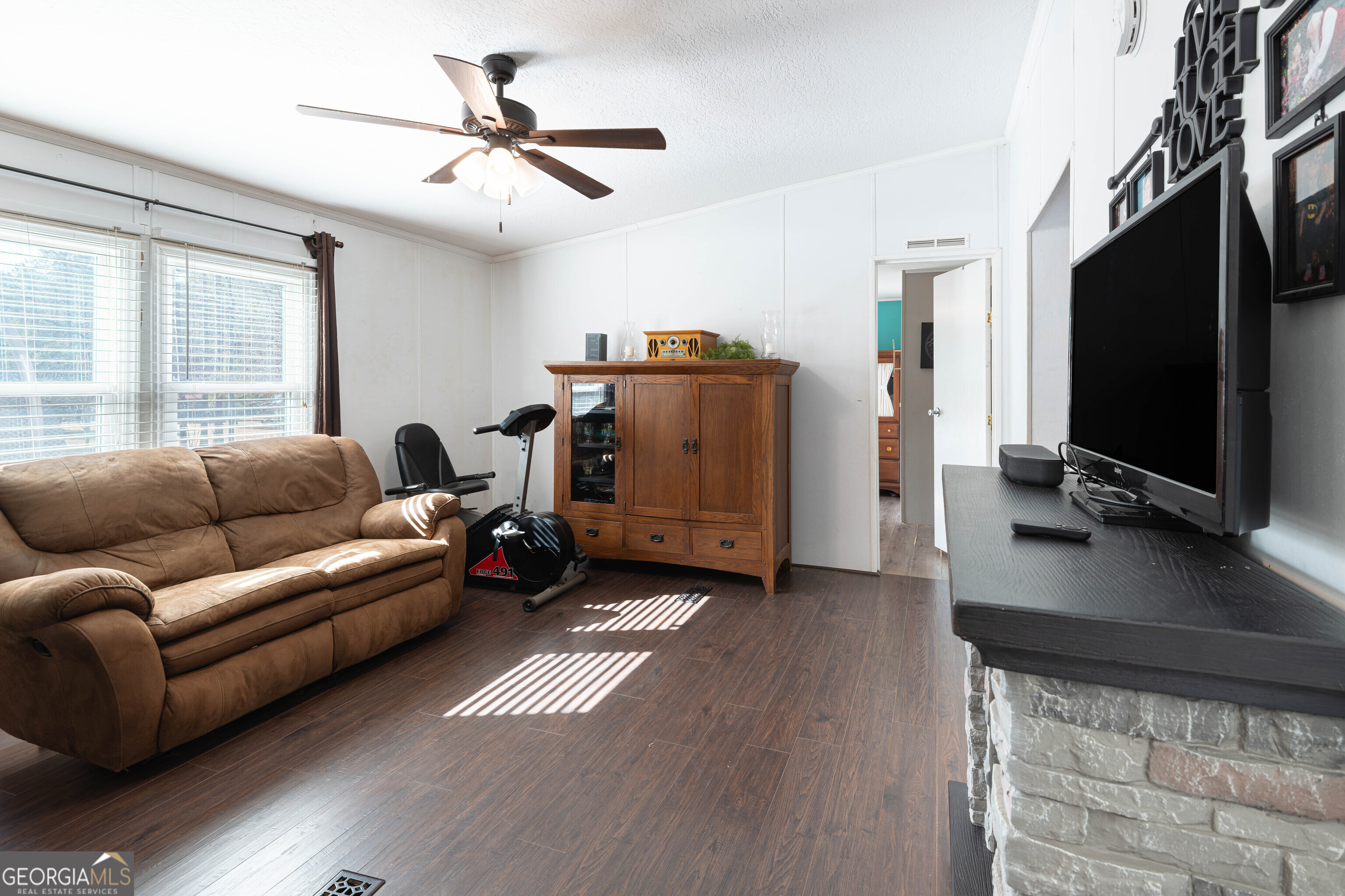 161 Cherokee Trail Forsyth, GA 31029 - Photo 34 of 39 a living room with furniture and a flat screen tv