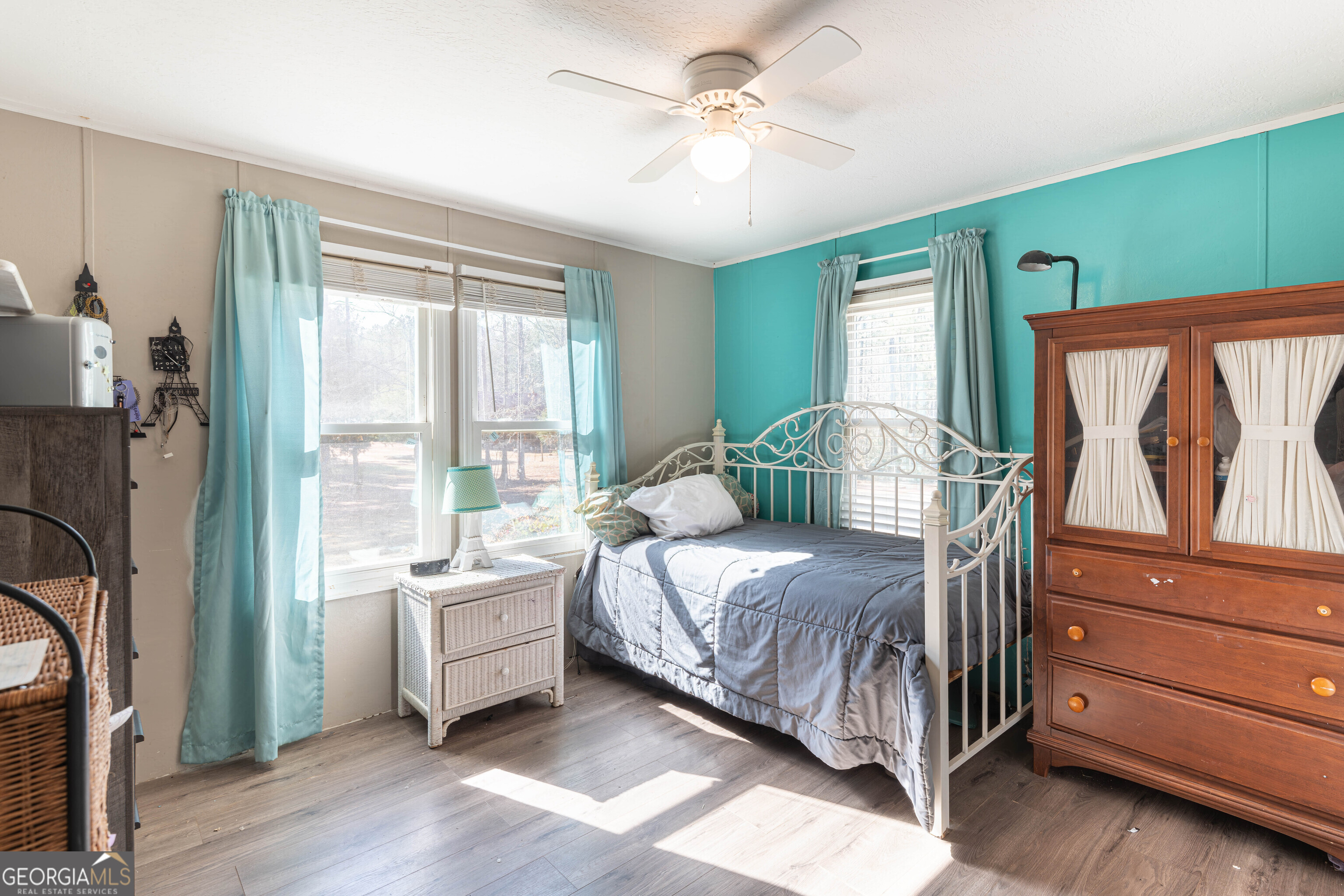 161 Cherokee Trail Forsyth, GA 31029 - Photo 36 of 39 a bedroom with a bed wooden floor and window