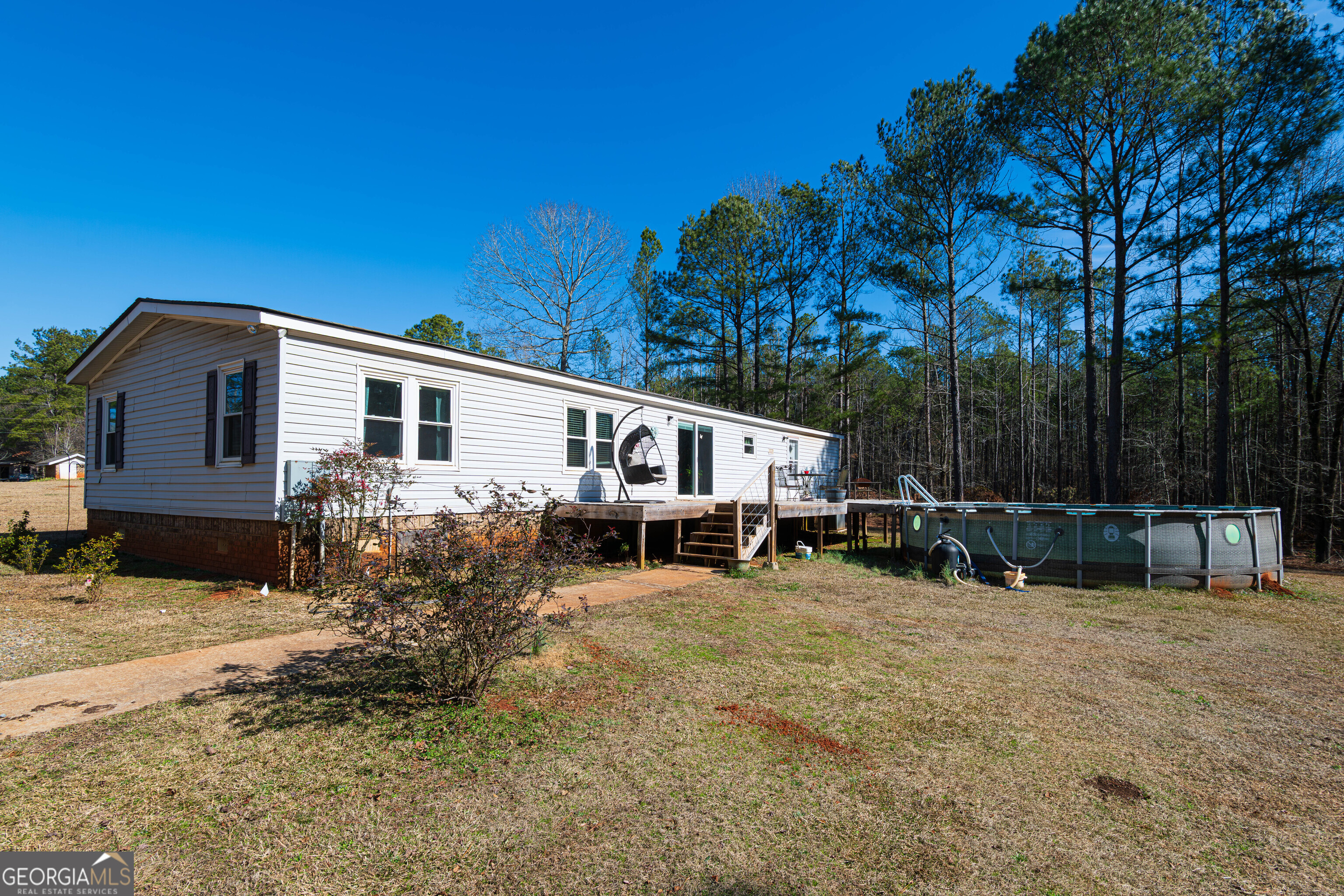 161 Cherokee Trail Forsyth, GA 31029 - Photo 4 of 39 a view of a house with a yard and sitting area