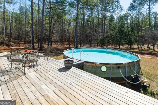 a view of a swimming pool with a patio