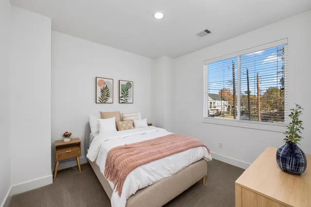 a bathroom with a toilet and shower