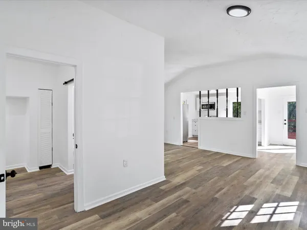 a view of a livingroom with wooden floor