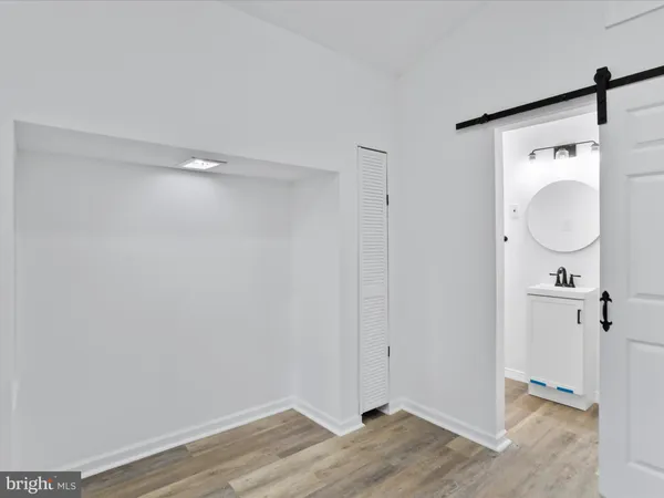a view of a bathroom with wooden floor