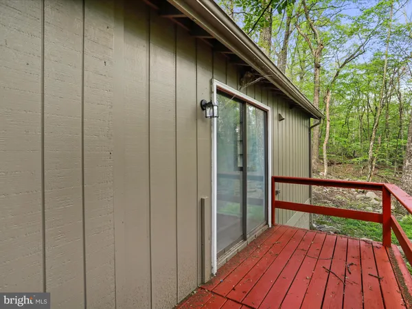 a view of balcony with wooden floor