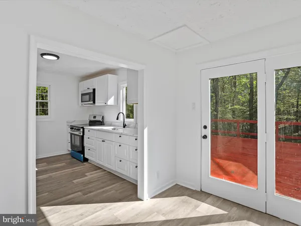 a room with mirror and window