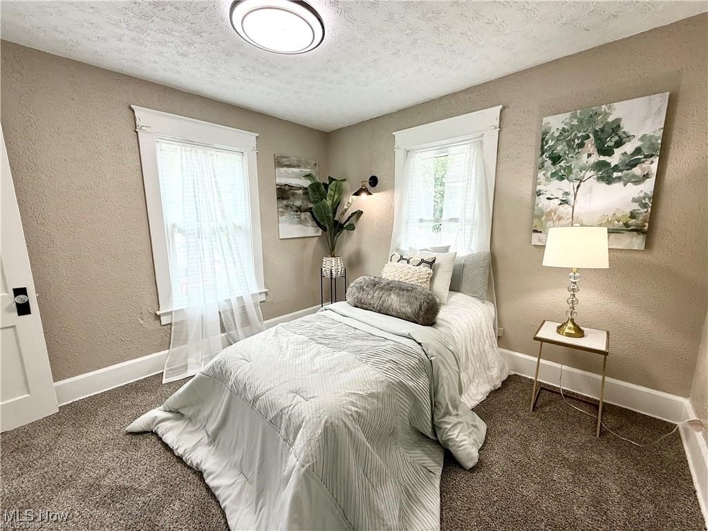 281 Sexton Street Struthers, OH 44471 - Photo 15 of 28 Bedroom with a textured wall, carpet flooring, and a textured ceiling