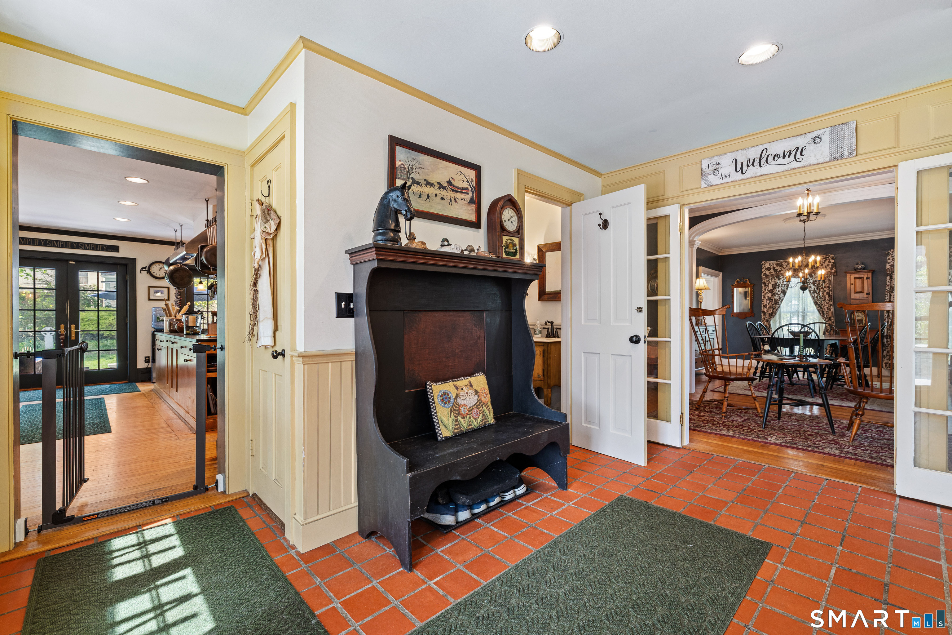17 Quaddick Road Thompson, CT 06277 - Photo 18 of 40 Mud room entrance with view into the kitchen at left and ahead into the dining room. To the right is a home office and the white door leads to the powder room.