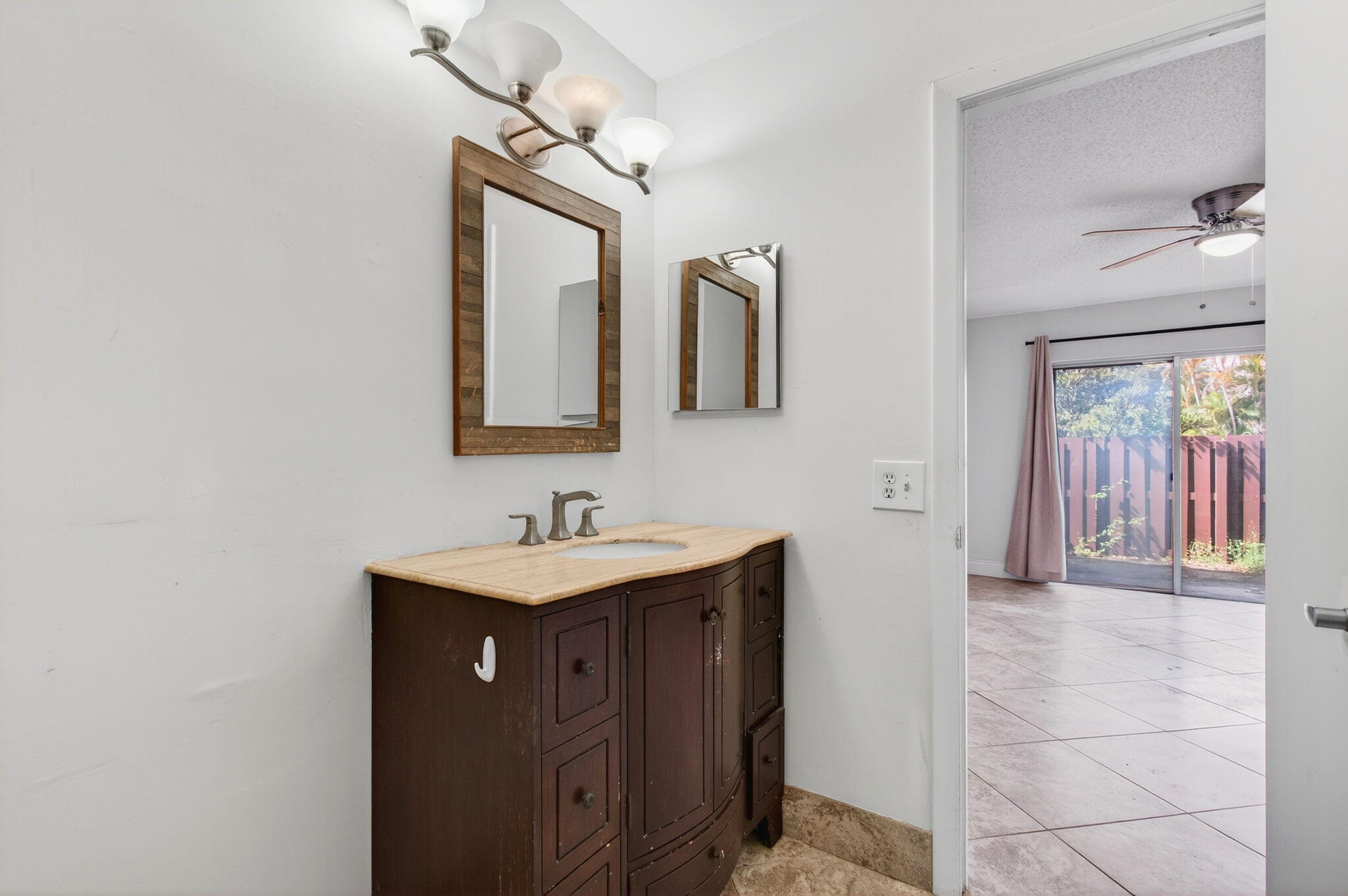 11609 Orange Blossom Lane Boca Raton, FL 33428 - Photo 10 of 30 a bathroom with a sink a mirror and vanity
