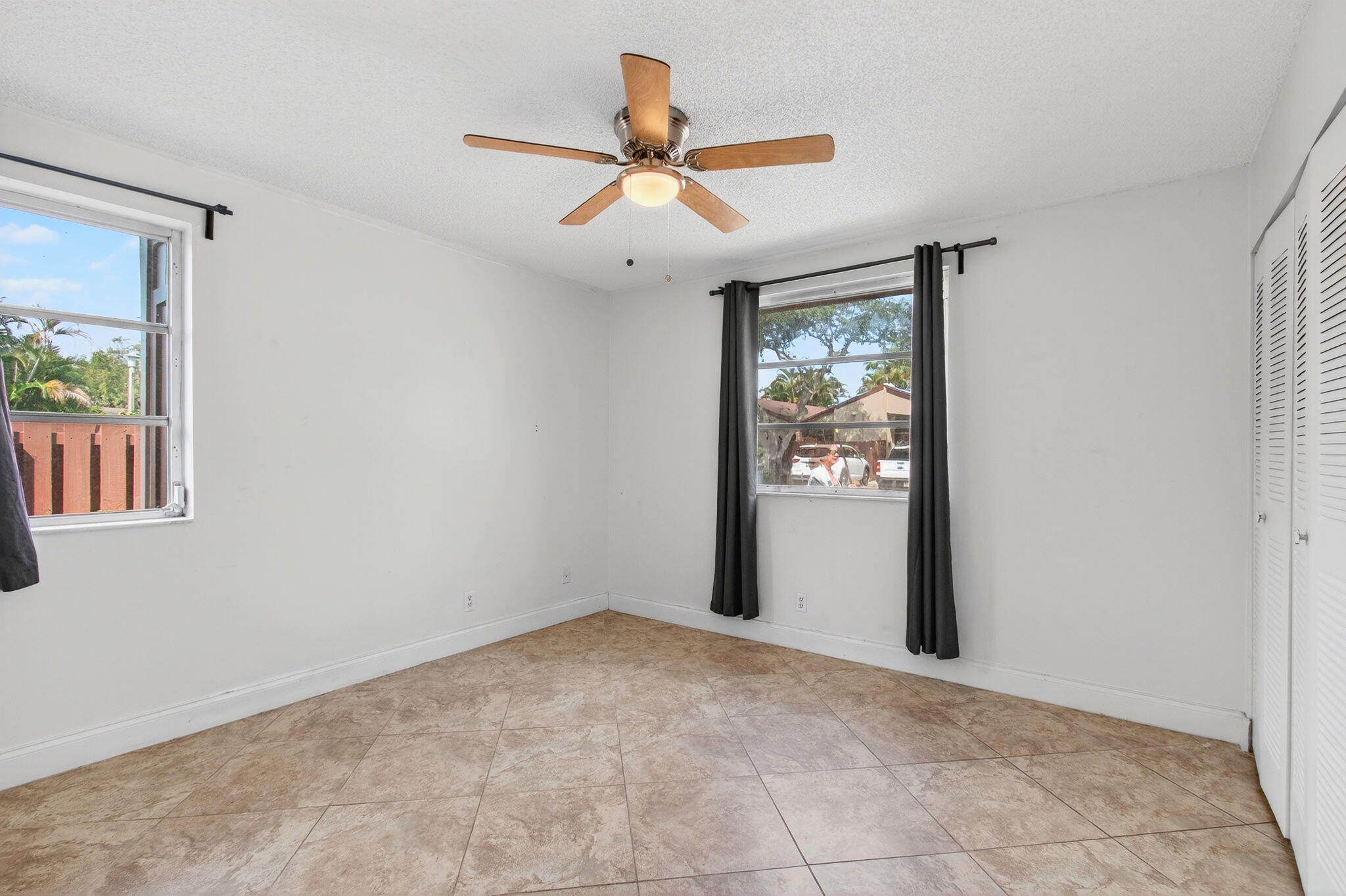11609 Orange Blossom Lane Boca Raton, FL 33428 - Photo 11 of 30 a view of an empty room with a window