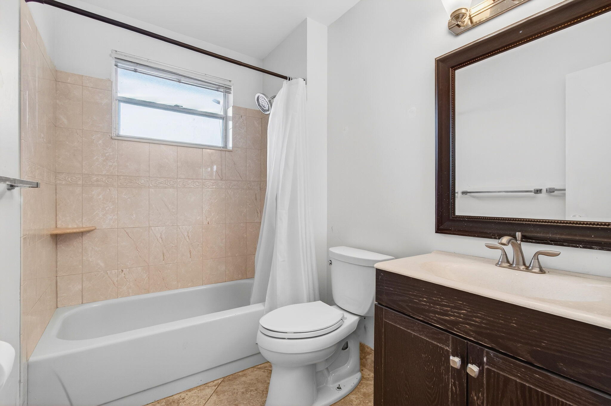 11609 Orange Blossom Lane Boca Raton, FL 33428 - Photo 13 of 30 a bathroom with a sink a toilet and a bathtub
