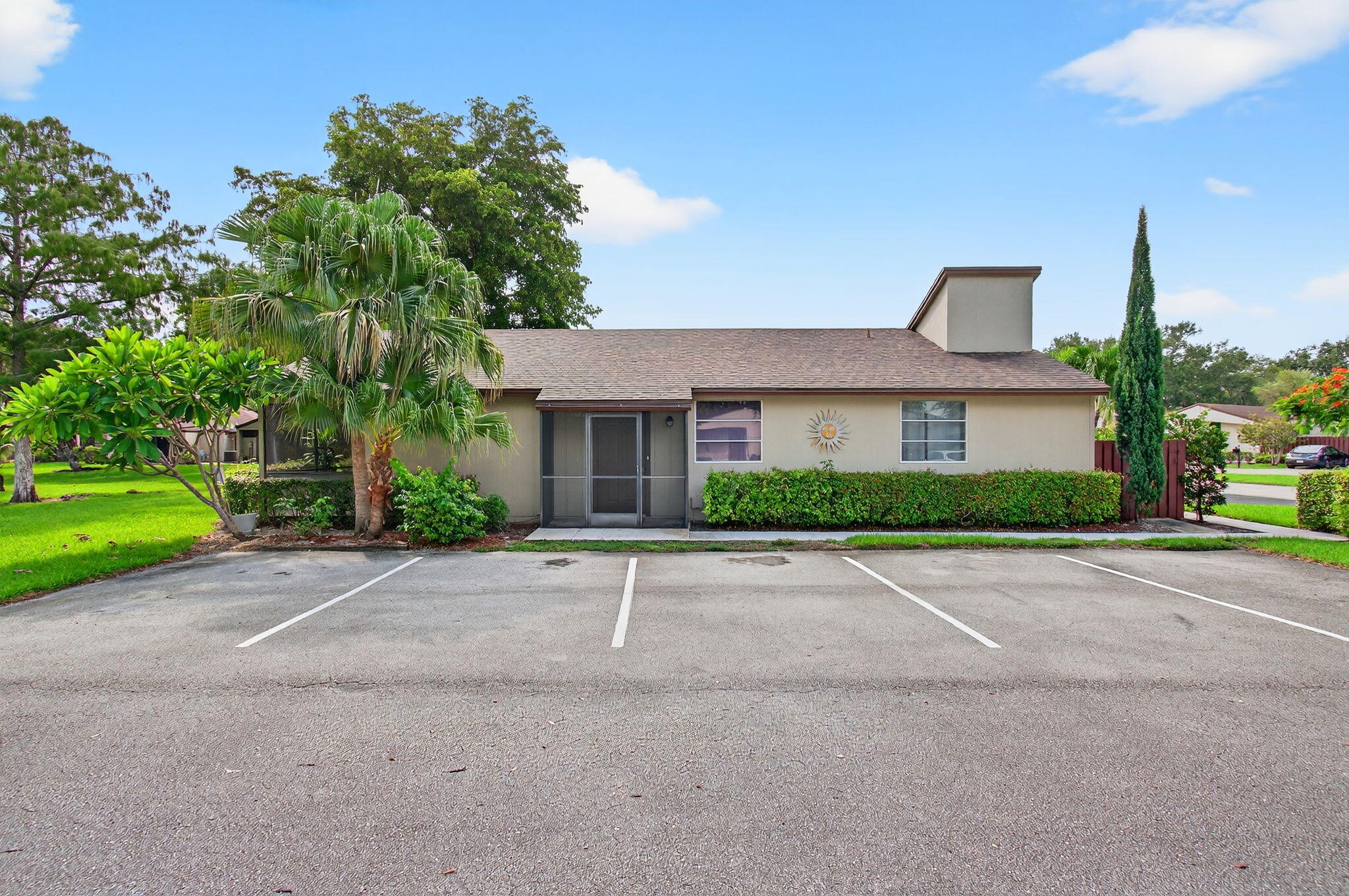 11609 Orange Blossom Lane Boca Raton, FL 33428 - Photo 2 of 30 a front view of a house with a yard and a garage